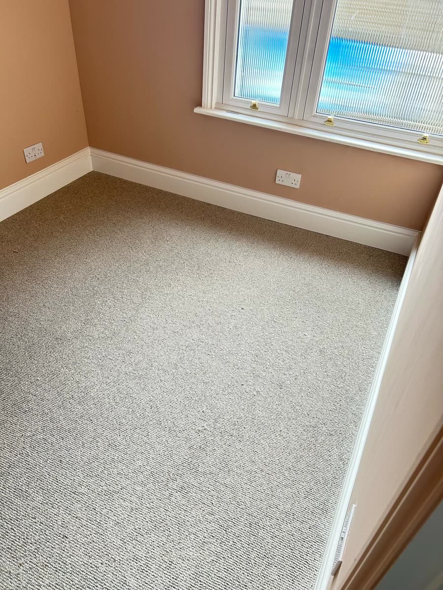 ThermaSkirt in a carpeted bedroom with a bay window